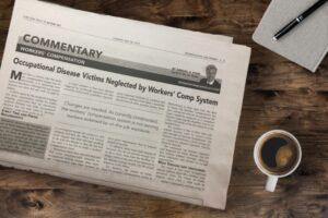 newspaper next to a mug