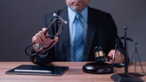 Photo of a judge making a ruling while holding a stethoscope.