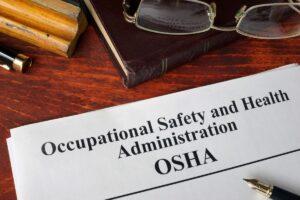 Photo of OSHA documents on a desk.