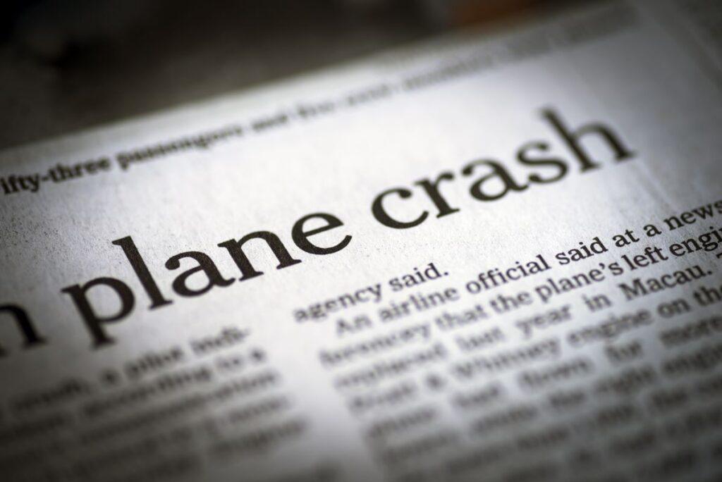 Newspaper emphasizing the headline "plane crash."