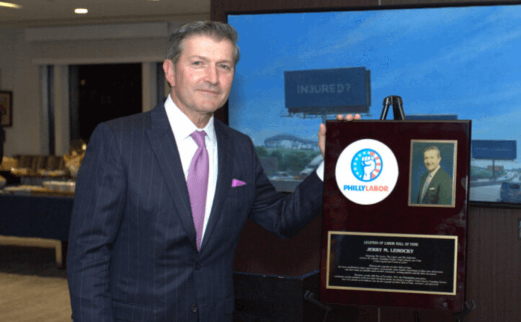 Photo of PLG founding partner Jerry Lehocky next to his Philly Labor award.