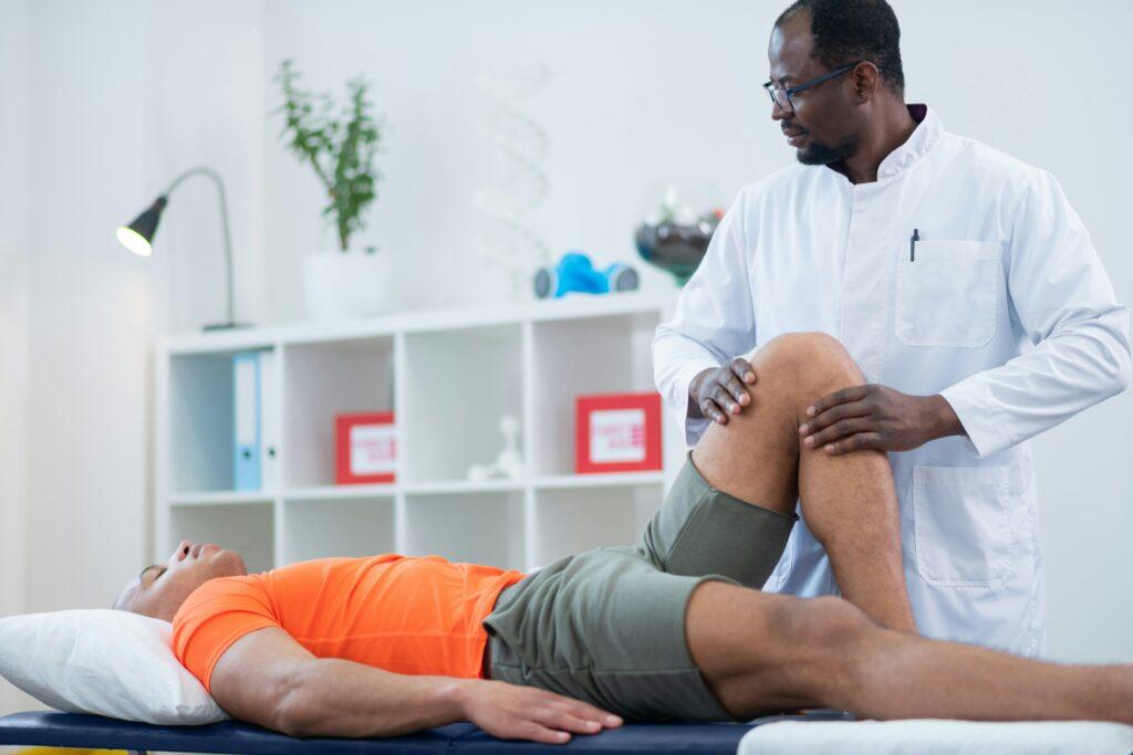 A man receives a medical exam from a doctor in a clinical setting, focused on health assessment.