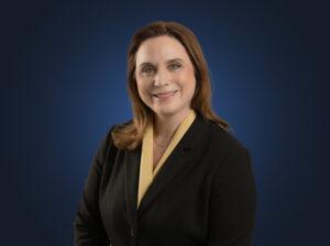 Attorney Marla A. Joseph, wearing a black suit in front of a blue background