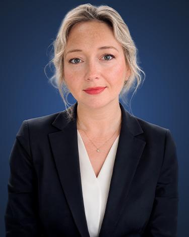 Aryna Anderson, wearing a dark suit